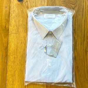 Calvin Klein, white with dark blue stripes.